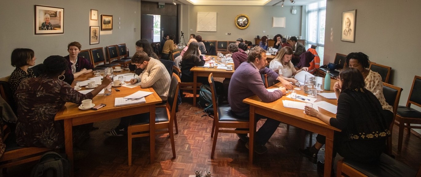 Breakout groups at the workshop discussing around smaller tables