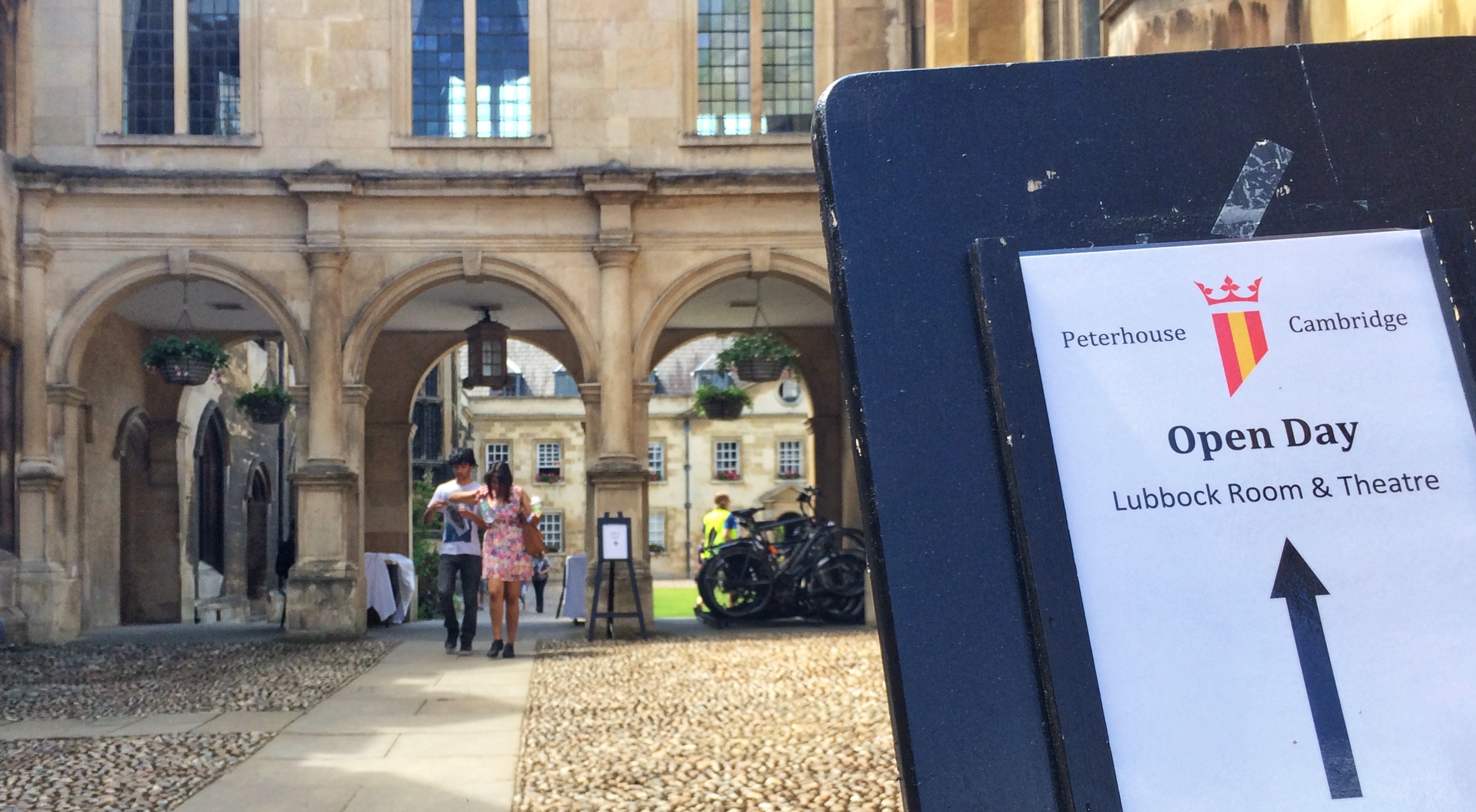 A signpost directing attendees for an Open Day at Peterhouse