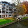 The Mathematical Bridge of Queens College spanning the river in autumn