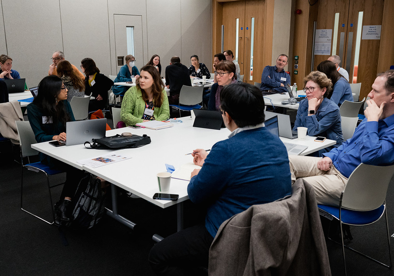Delegates at a table having a discussion during a workshop