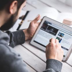 Man using a tablet to study
