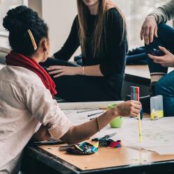 Photo of students working on a project together