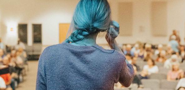 Lecturer preparing to each looking out on the audience