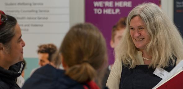 Meg Tait, Head of CCTL, talking to delegates during a break at the 2023 Teaching Forum