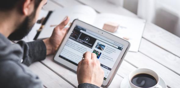 Man using a tablet to study