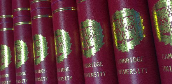 Row of burgundy Cambridge University scrolls
