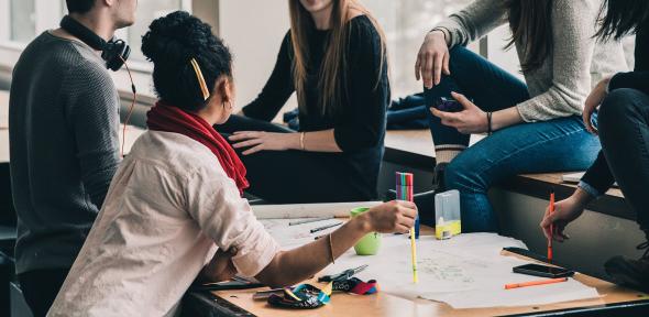 Photo of students working on a project together