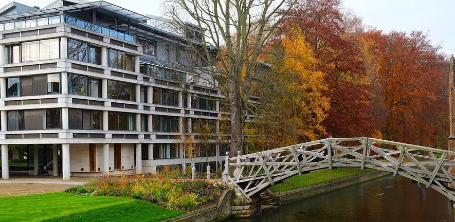 The Mathematical Bridge of Queens College spanning the river in autumn