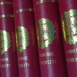 Row of burgundy Cambridge University scrolls