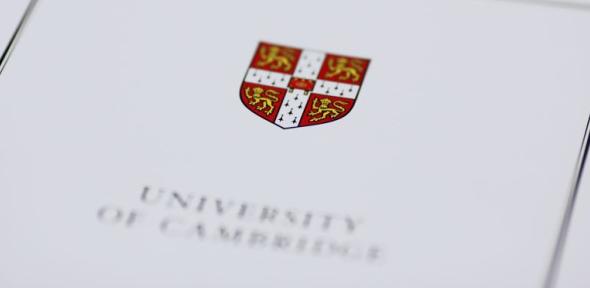 University shield on the front cover of a publication